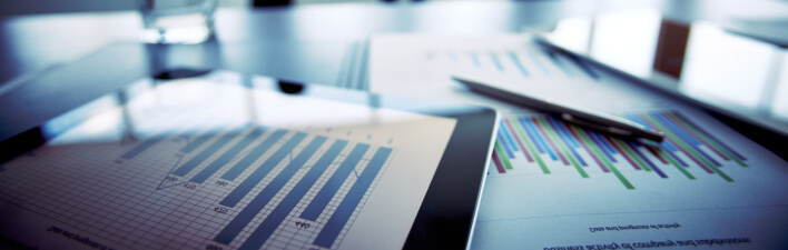 graphs and charts in a boardroom mobile 708x225 1 1