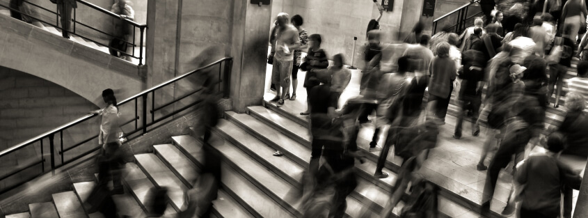 web application security introduction People rushing up and down a staircase in an atrium