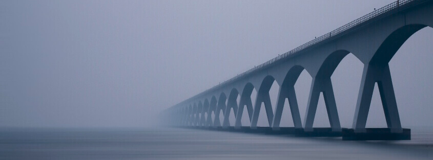 Bridge covered in fog