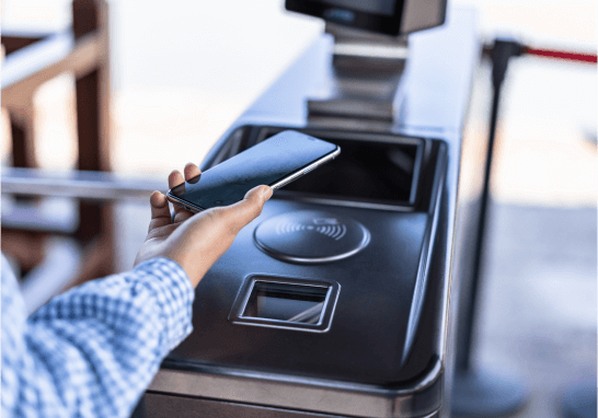 hand holding phone to use mobile pay