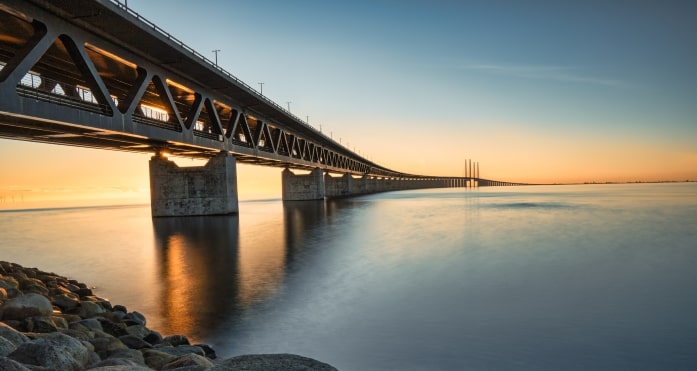 bridge over water at sunset